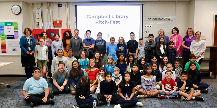 Student participants and district and community leaders pose for a photo at the 2019 Pitch Fest.