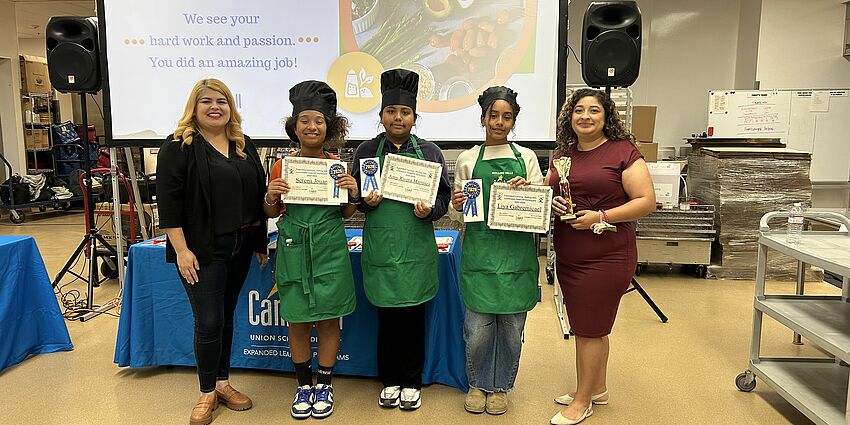 The winning team from Rolling Hills Middle School pose with their awards and Expanded Learning staff.