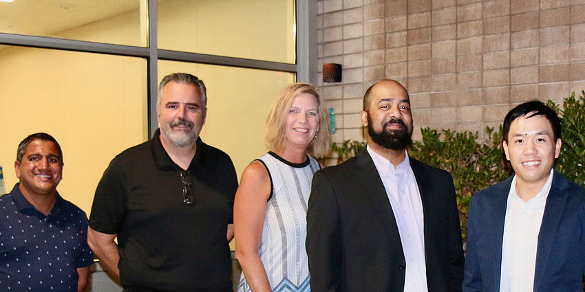 board members-4 men, one woman-standing