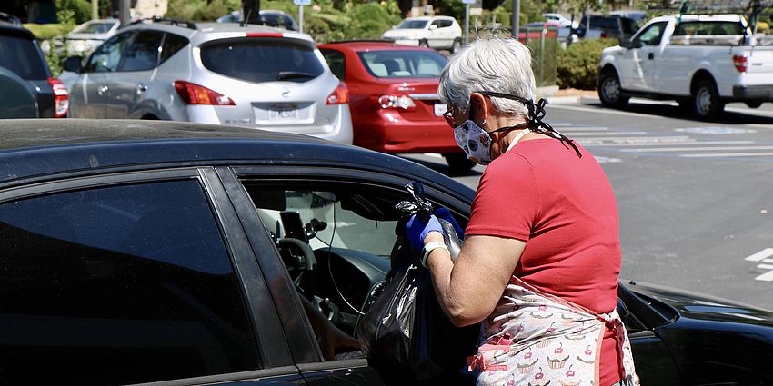 meals being handed to person in car