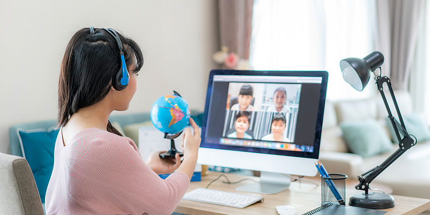 girl learns at home via computer