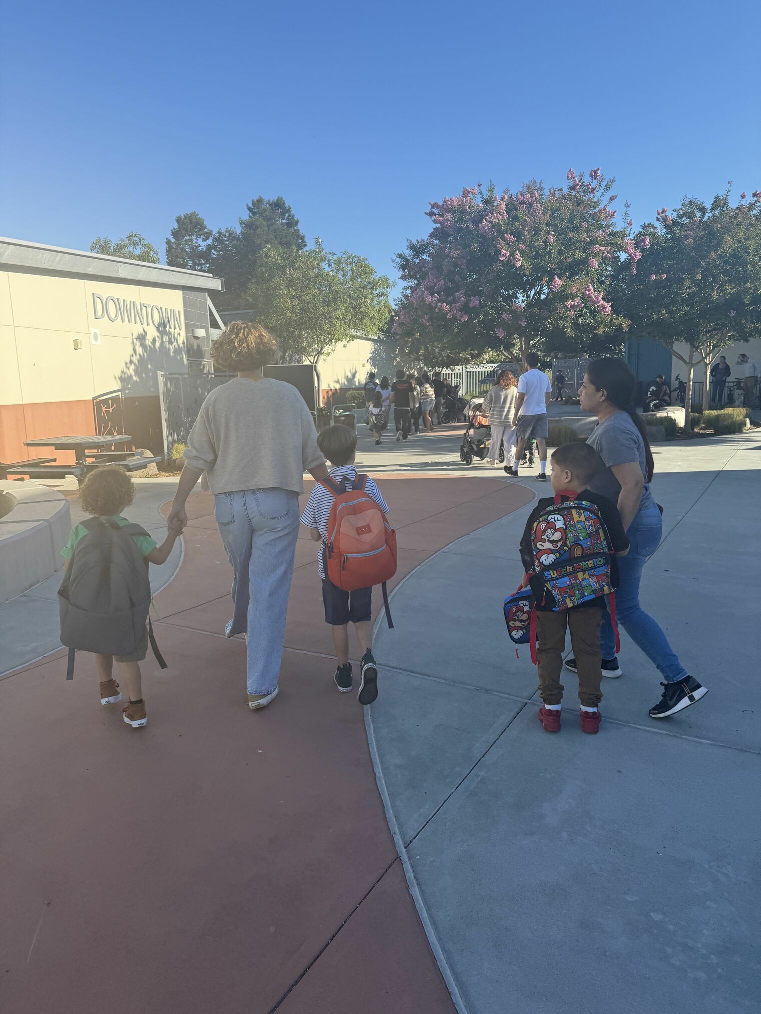 Parents walking students to class on the first day of school