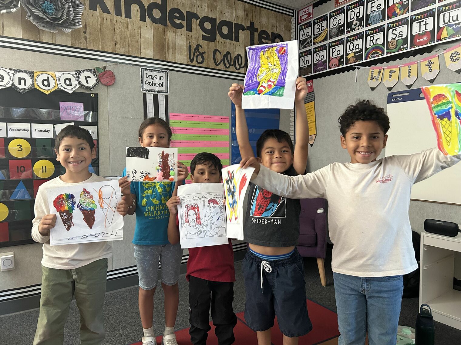 Expanded Learning students proudly display their summer art projects.