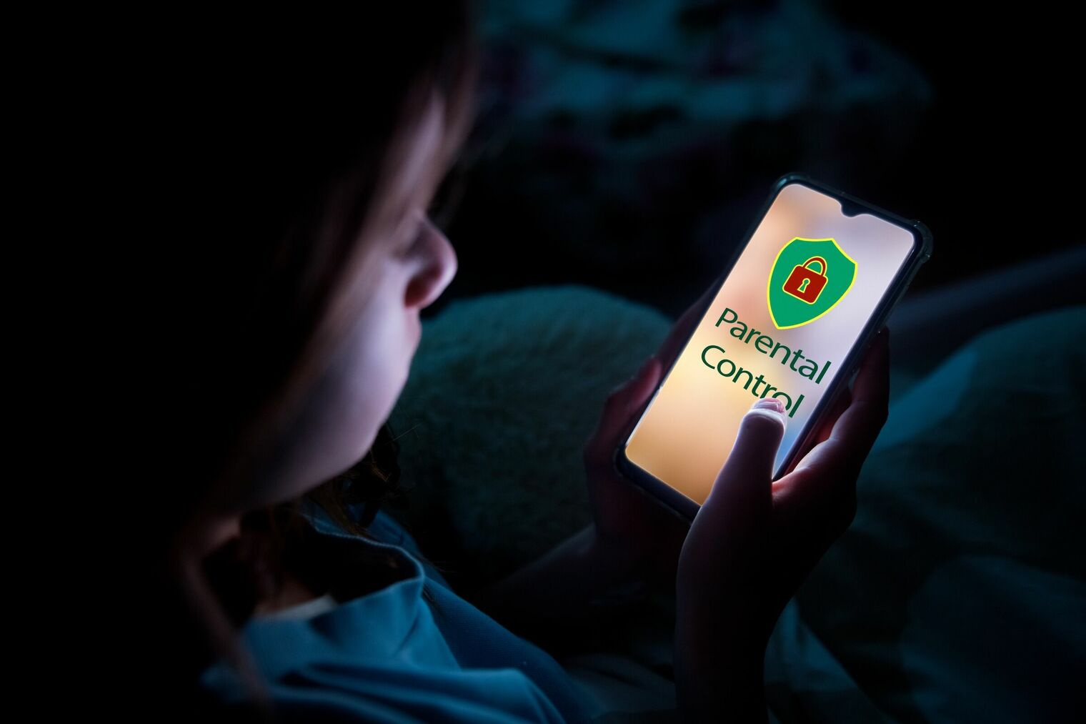 young child looking at cell phone and screen says Parental Control