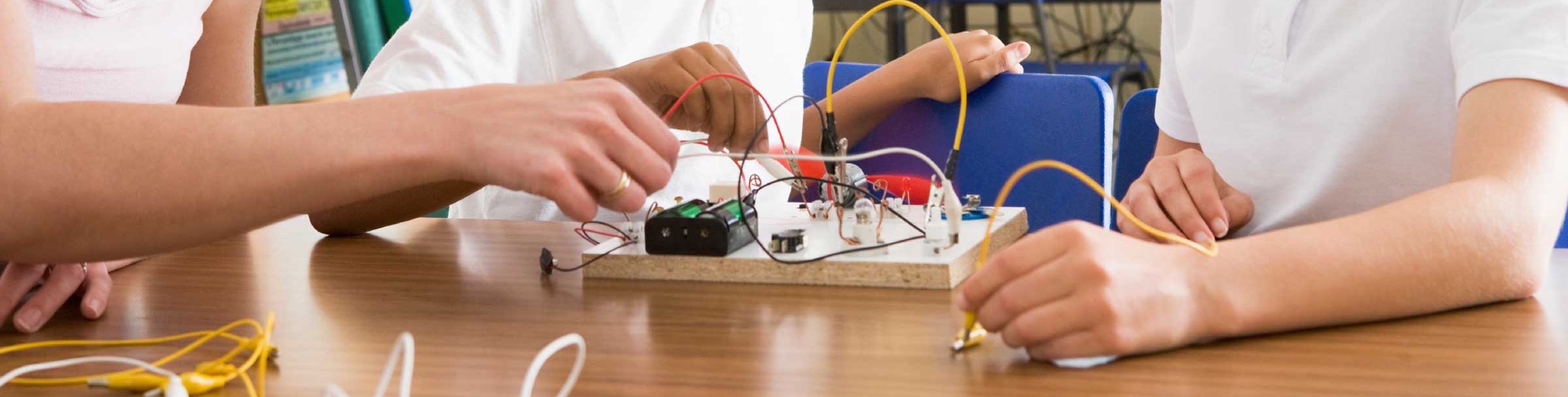 kids working with wires on a project